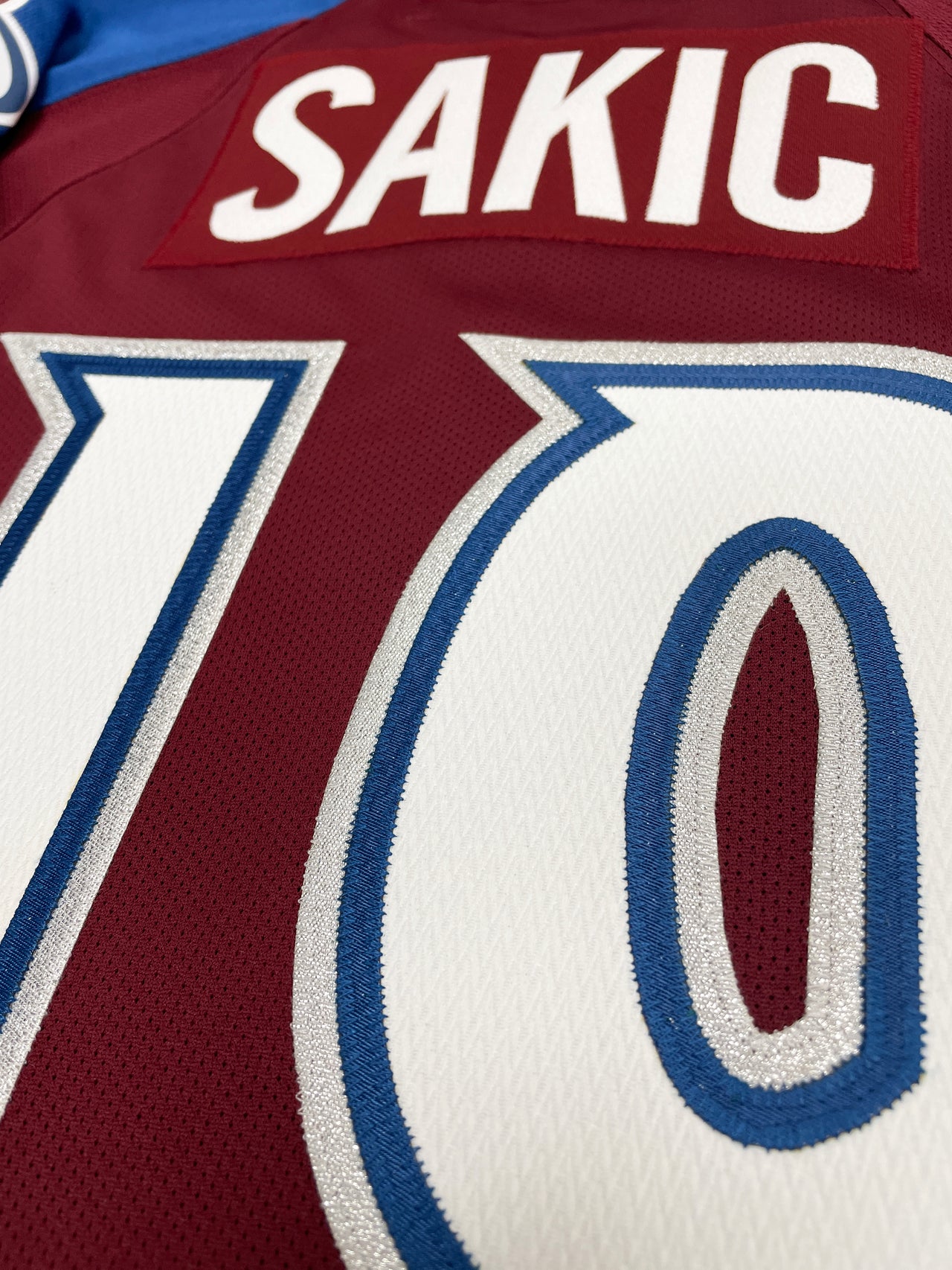 JOE SAKIC COLORADO AVALANCHE HOME PREMIER REEBOK NHL JERSEY